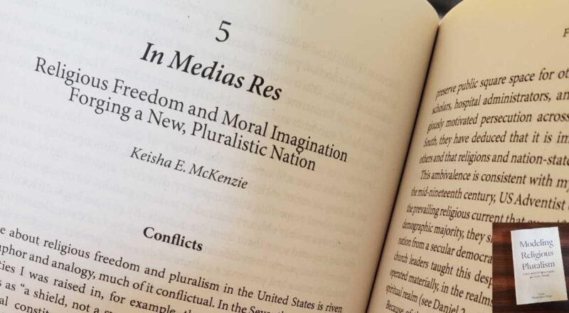Close-up of a book chapter—chapter 5: "In Medias Res: Religious Freedom and Moral Imagination in a New, Pluralistic Nation. Keisha E. McKenzie." Inset image is of the book cover on a dark background: Modeling Religious Pluralism: Cultivating Religious Equity in Today's World